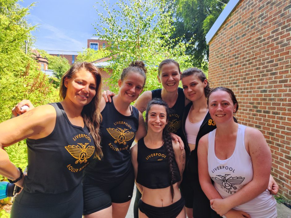 Picture of six team members wearing Liverpool Roller Birds tops.